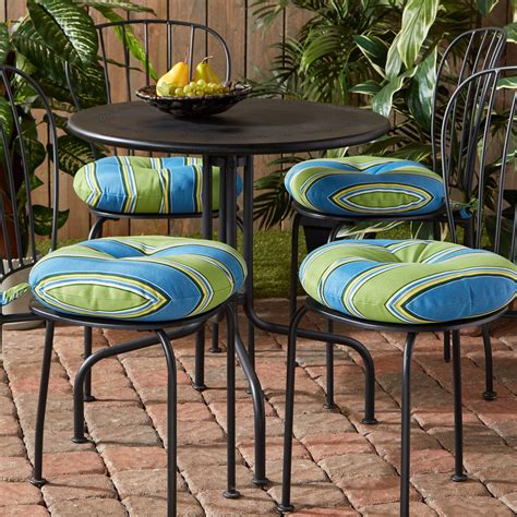 The Greendale Home Fashions Bistro Cushion features two string ties to secure to chairs, and a center circle tack to secure foam cushioning in place without bunching or migrating. . Bistro chair round cushions